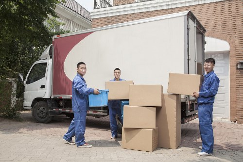 Professional team packing office equipment for relocation