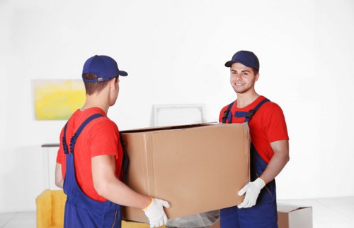 Packing team preparing boxes in warehouse