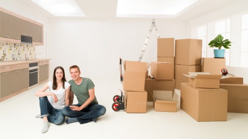 Professional packing team loading a van