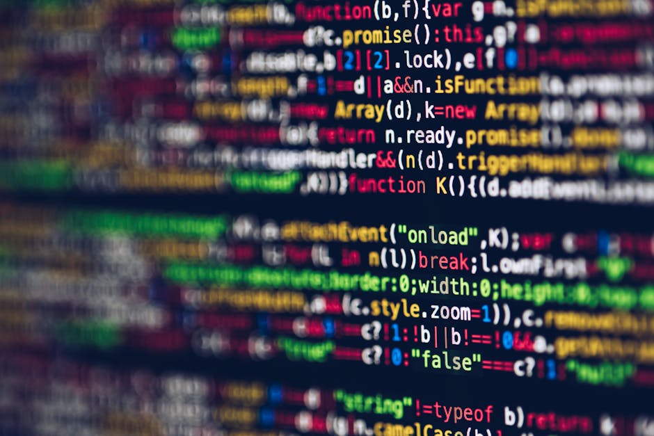 A close-up photograph of a computer screen displaying its source code with multicolored text on a black background, including snippets of HTML and error messages such as 'Authentication Failed' in red